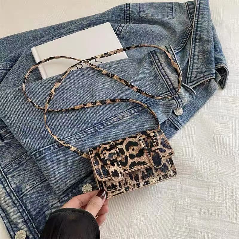 Fia leopard print mini bag with matching long strap laid out