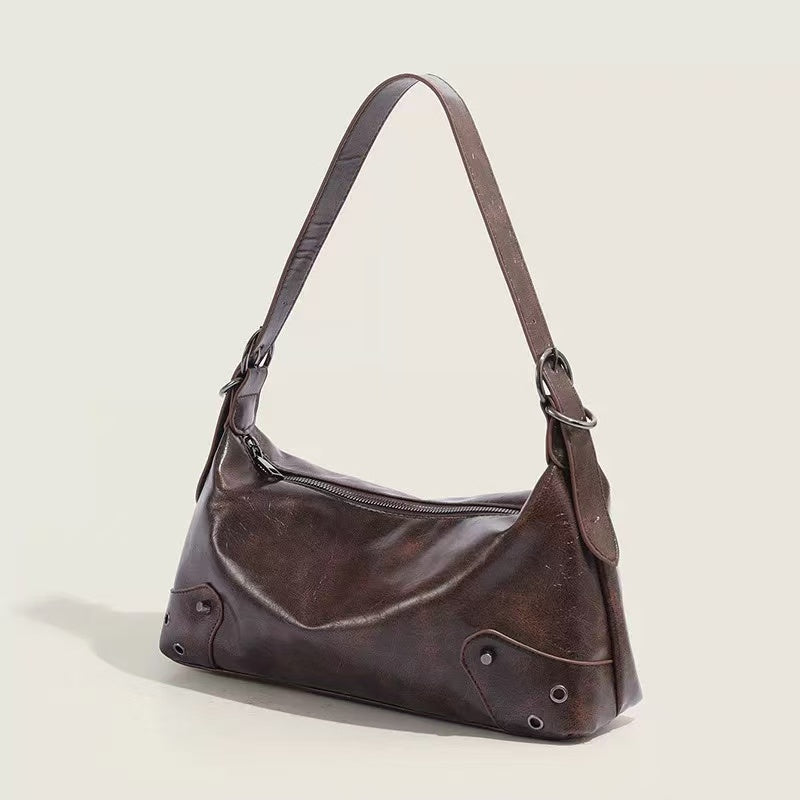 Marlow Chocolate Brown shoulder bag, angled view of metal details