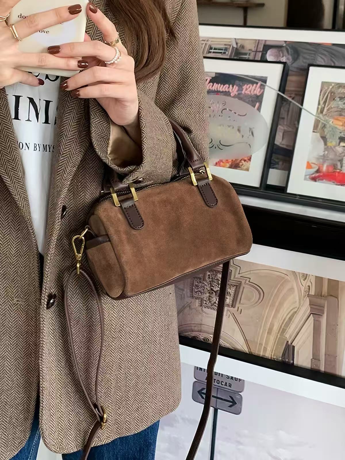 Marnie mini Boston bag showing dark trim and shoulder strap hardware
