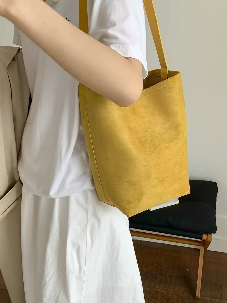 Saffron yellow shoulder tote, close-up lifestyle view