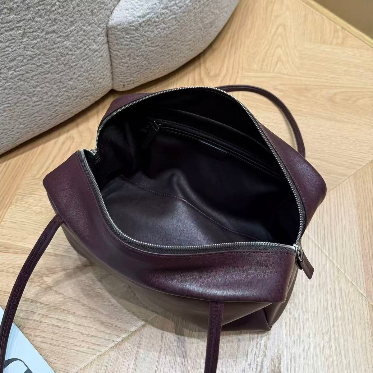 Vesper shoulder bag showing the interior and zipper details
